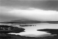 Moody landscape. Lochans, hills, South Uist. Black and white
