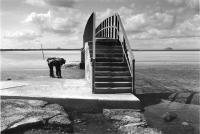 Bridge at Belhaven Bay, Dunbar, two figures. Black and white