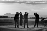 Longniddry golf course. Four golfers. Arthur's seat background. Black and white