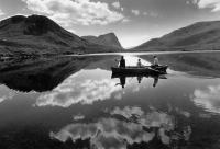 Loch fishing from boat, isle of Harris. Black and white